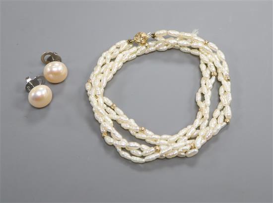 A pair of modern 14k white metal and cultured pearl ear studs and a modern rice pearl and yellow metal bead necklace with 14k clasp.